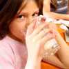 Got Raw Milk? Don't Drink It! Girl drinking milk