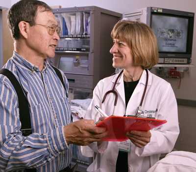 A patient gets more information about a colonoscopy from his provider at the Alaska Native Medical Center.