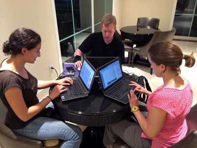 On the ground at the Ebola outbreak in Guinea, (From left to right) CDC disease detectives Ilana Schafer, Erik Knudsen and Andrea McCollum use the new Epi-Info software tool to track down people exposed to the deadly virus.