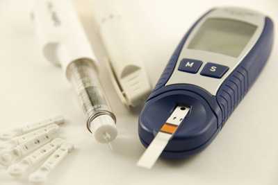 Photo: Blood sugar meter with lancets.