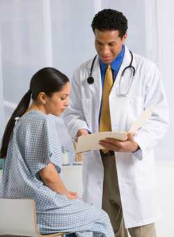 Physician talking to a woman patient