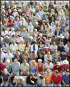 A crowd of people sitting in a stadium