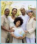 Adults gathered around a child with a globe.