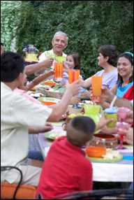 A family eats outside