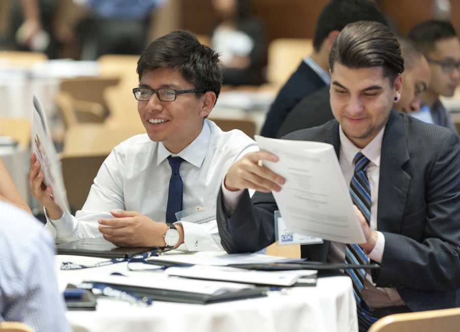 close up of two male students attending the orientation