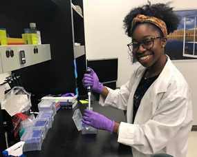 Janessa Aneke working in lab