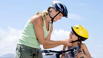 	Photo: Mother and daughter wearing bicycle helmets