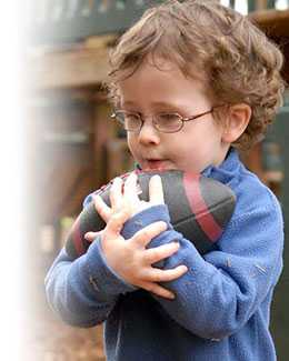 Little boy holding a football