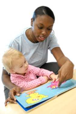 Photo: Woman reading to child