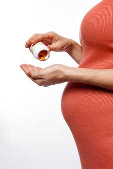 Pregnant woman taking medication