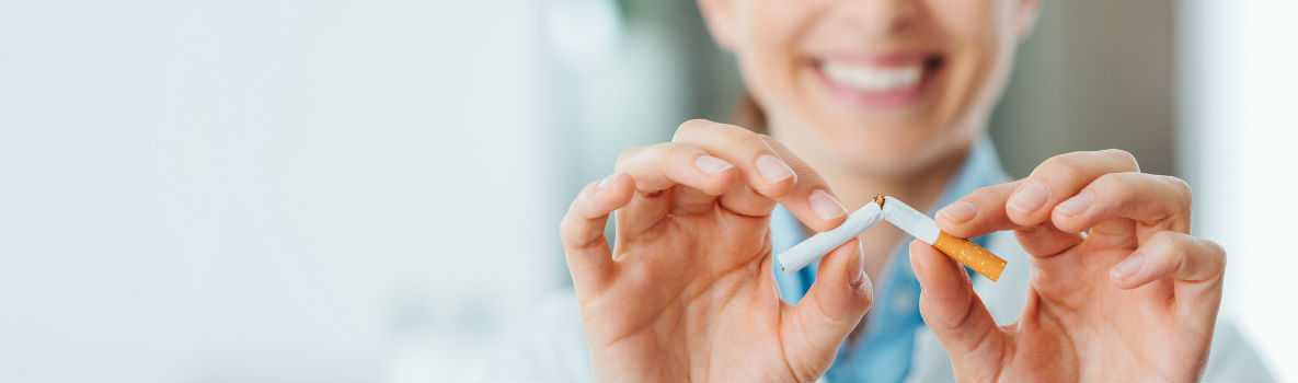 Photo of health professional breaking a cigarette