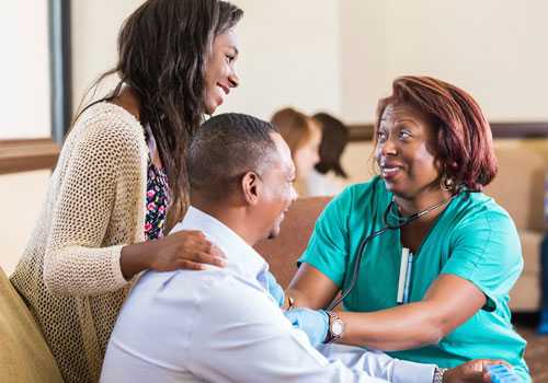 A couple talking with their doctor