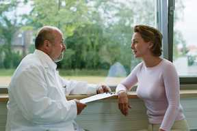 doctor talking with female patient