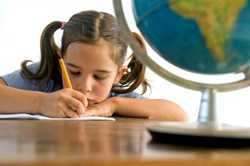 Girl writing at desk