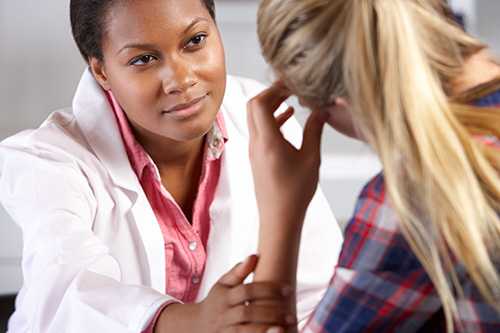 Teenage Girl Visits Doctor's Office