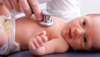 Doctor listening to baby's heart