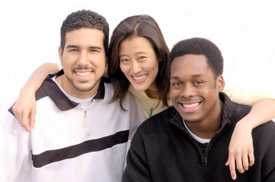 Two men and a woman posing for a picture