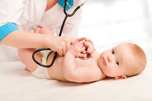 Doctor examining baby