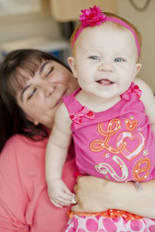 Photo of mother holding baby with Thalassemia