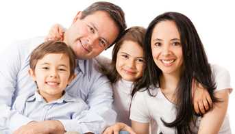 Family of four posing for a picture.