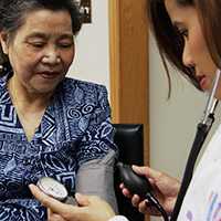 Nurse taking blood pressure