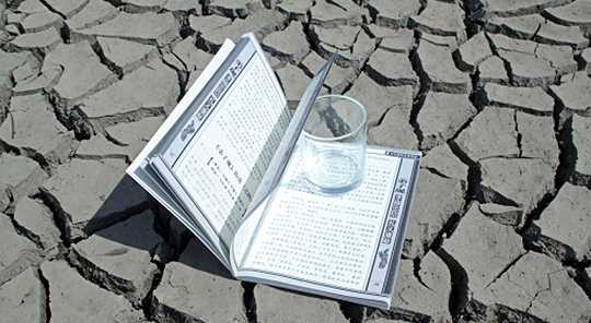 open book on sun baked earth