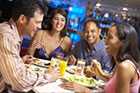 Photo of two couples dining in a restaurant