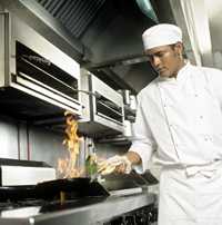 Photo of a chef sauteeing food.