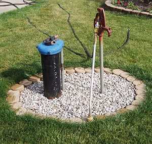 	Photo of a common household private well in a yard.