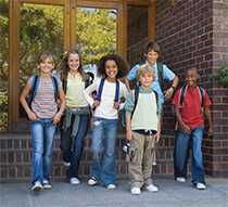 Group of children leaving school building