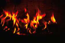 fireplace with burning logs