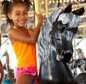 Child riding horse on mary-go-round