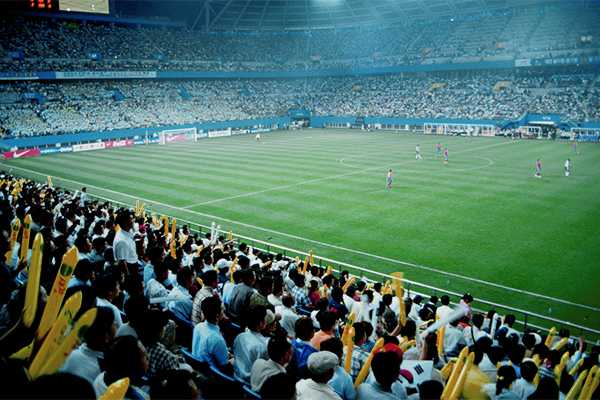 Fans watching a soccer match.