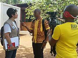 Photo: Rana Hajjeh being interviewd by the local radio station in Forecariah, Guinea where her team launched the first public awareness campaign in collaboration with the MOH in April 2015