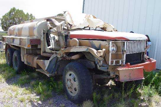 Photo 2. Tanker involved in rollover after recovery from the canyon.