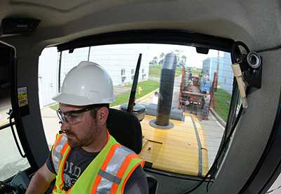 Driver in enclosed cab with positive pressure