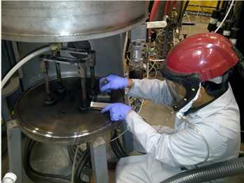 	Nanomaterial worker cleaning a reactor