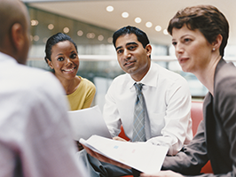 business people sitting and talking in a office building