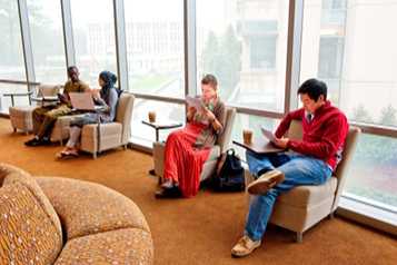 3 college students studying in the library.