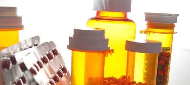 Display of pills and capsules in amber containers