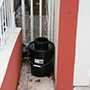 The photo depicts a CDC mosquito trap in use at a Puerto Rico home. 