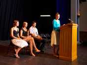 photo: woman giving a presentation