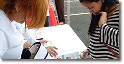 A pregnant women receives a Zika Prevention Kit and counseling at a Zika Action Day in Puerto Rico