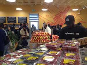 Man picking berries from grocery store