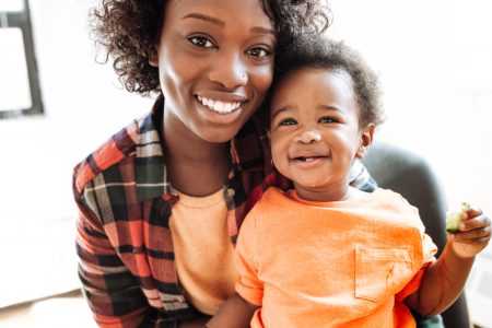 mother and a baby smiling