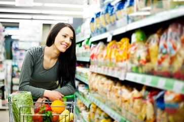 Woman shopping in grocery store.