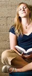 woman sitting with a book