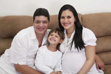 child, father and pregnant mother