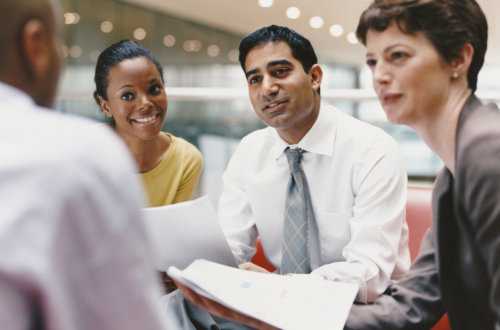 Four Professional People in a Discussion