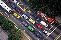 Cars and buses on a busy street.